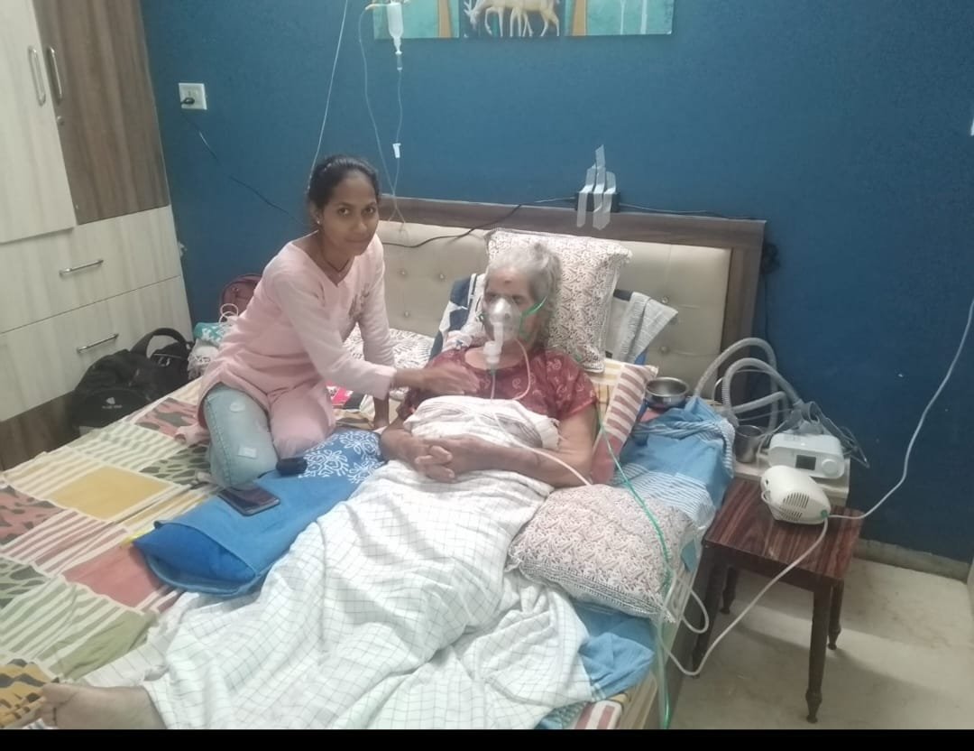 Home caregiver supporting a patient at home