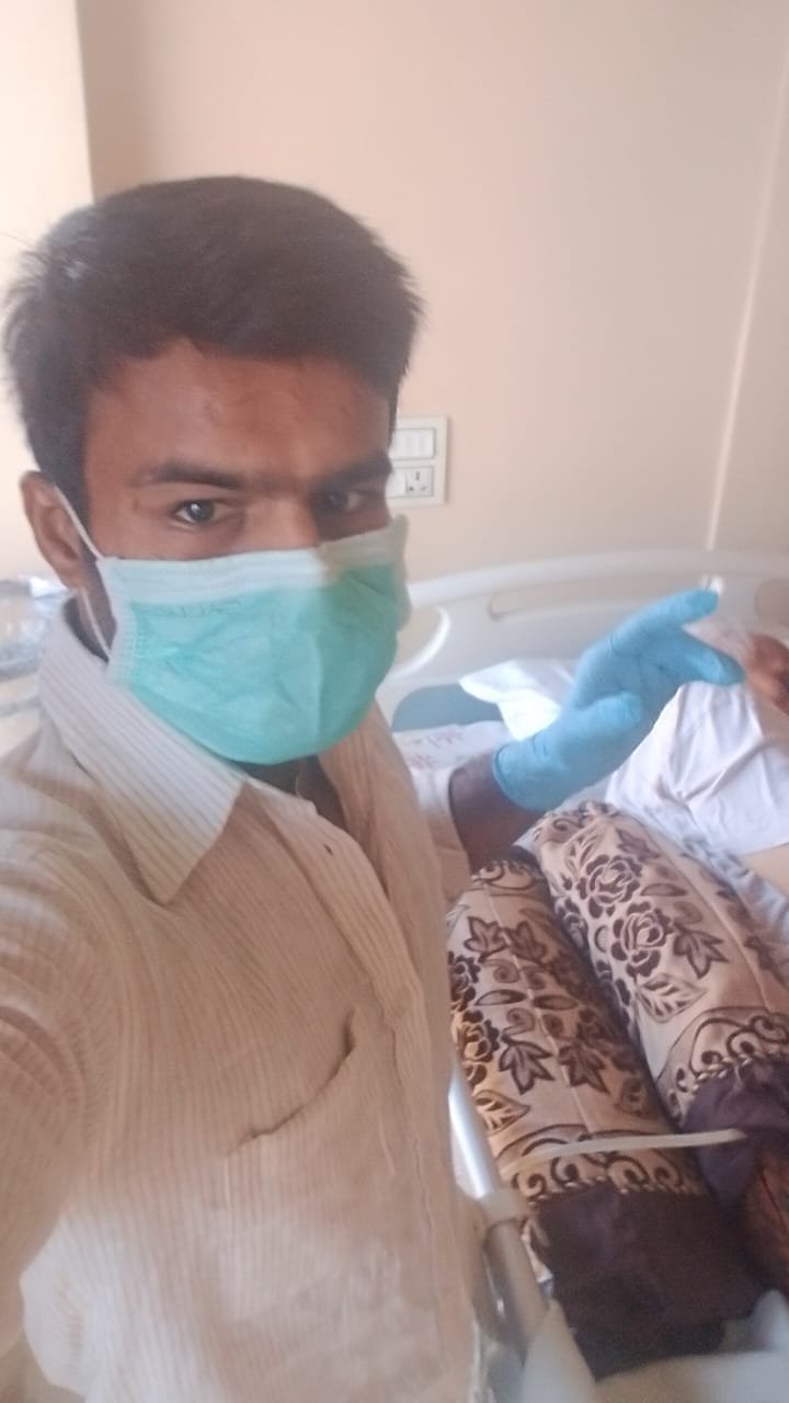 Masked caregiver in a patient setting